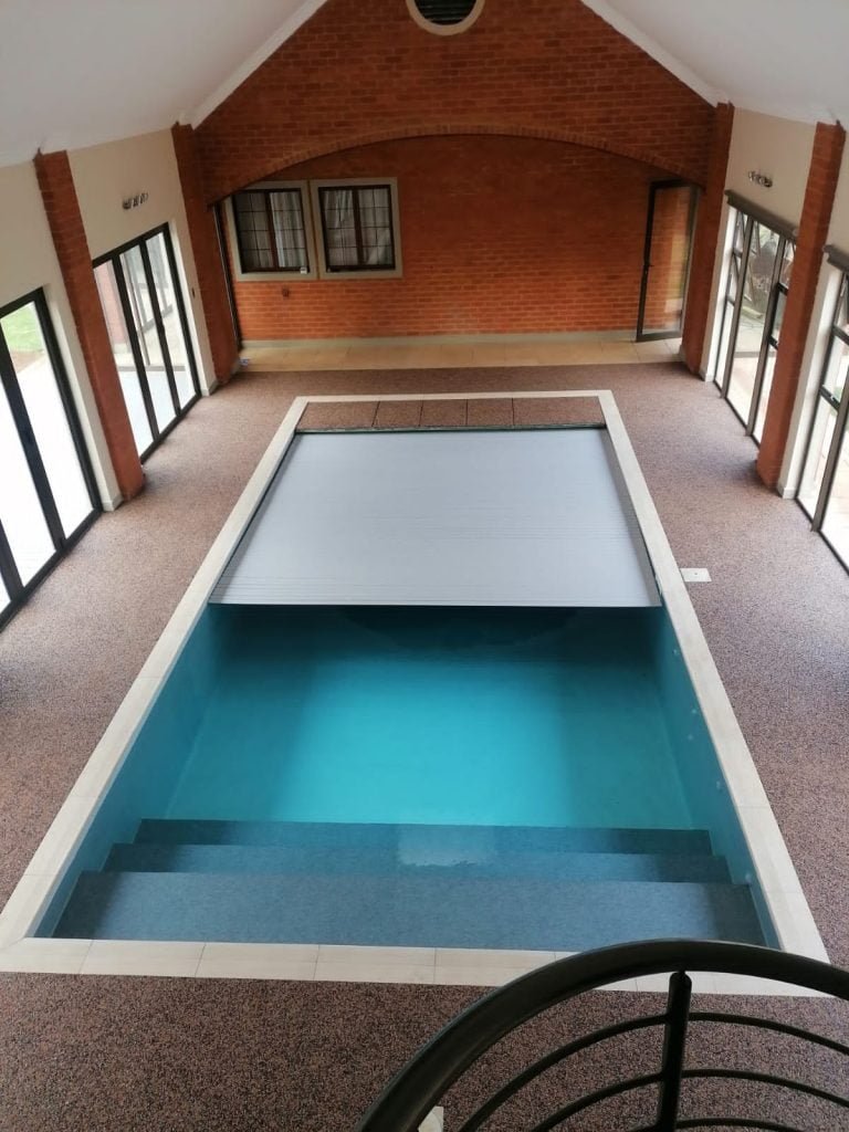 designer pool covers An indoor swimming pool in a house.
